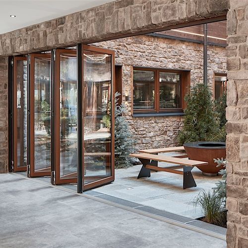 Baie vitrée coulissante-empilable - NW 540 - NanaWall - pliante / structure en bois / à double vitrage