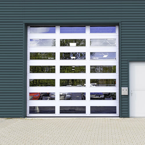 Porte industrielle sectionnelle - EXTREME™ SERIES - Cornell - en aluminium / en acier / de sécurité