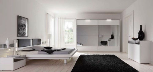 Armoire contemporaine - RIVANA - Nolte - en verre / à portes coulissantes / avec miroir