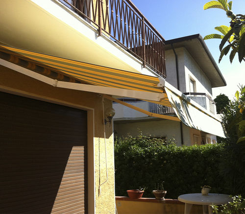 Store enrouleur - PRISMA - KE Outdoor Design - en tissu / d'extérieur / professionnel