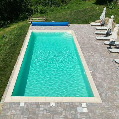Piscine à débordement - Classica - Piscine Acquaform - couverte / sur mesure / margelle intégrée