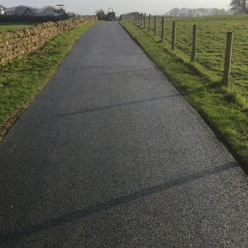 Revêtement de sol en béton - SUPERBASE™ - Aggregate Industries - en asphalte / pour extérieur / pour le tertiaire