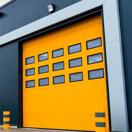Porte industrielle sectionnelle - FLEXIDOOR SA - en tôle d'acier / automatique / résistante au vent