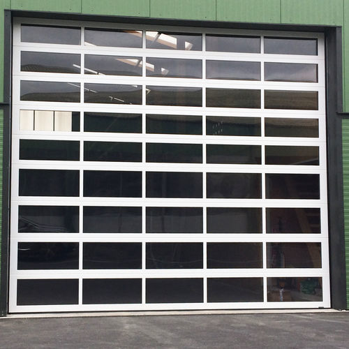 Porte industrielle sectionnelle - ELEMENT-R - La Toulousaine - en acier / de sécurité / résistante au vent