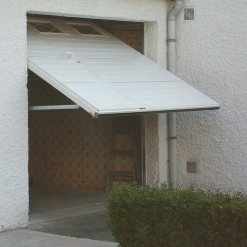 Porte de garage basculante - SMF Services - en acier inoxydable / en mousse de polyuréthane / automatique