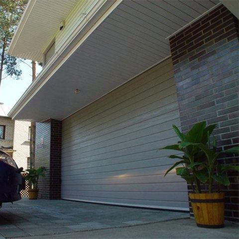Porte de garage sectionnelle - IDO-HOME - IDOMUS - en acier / automatique / isolante
