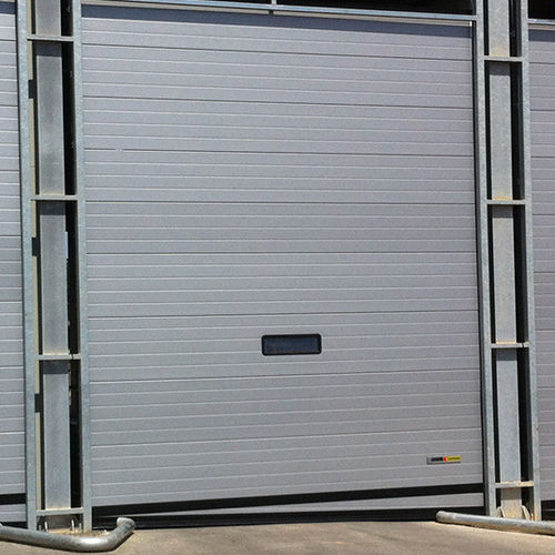 Porte industrielle sectionnelle - MADE-TO-MEASURE - KOPRON - en métal / automatique / à isolation thermique