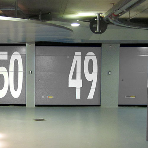 Porte de garage sectionnelle - KOPRON - en acier / en tôle perforée / automatique