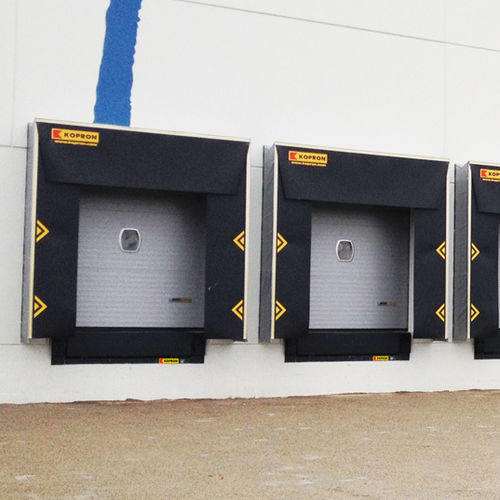 Porte industrielle sectionnelle - LOWERED LINTEL - KOPRON - en métal / automatique / à isolation thermique