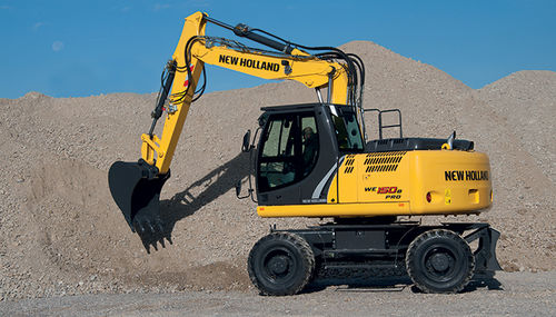 Pelle intermédiaire - WE 150B PRO - New Holland Construction - sur pneus / multifonction / pour chantier