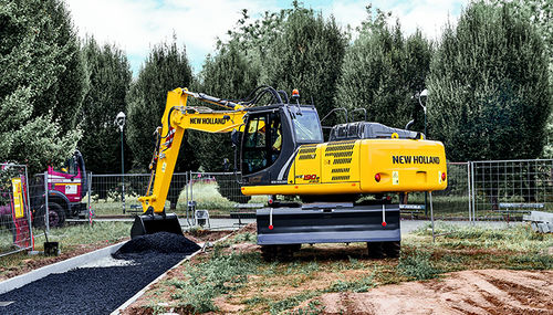 Pelle intermédiaire - WE 190B PRO - New Holland Construction - sur pneus / multifonction / pour chantier