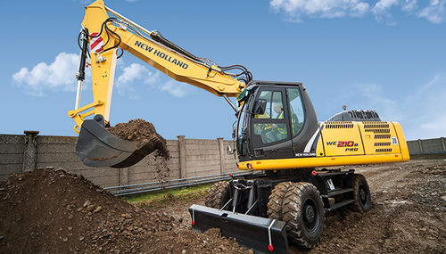 Pelle intermédiaire - WE 210B PRO - New Holland Construction - sur pneus / multifonction / pour chantier