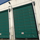 porte industrielle sectionnelle / en inox / grande hauteur / résistante à la corrosion
