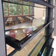 brise-soleil à lames / en verre / pour fenêtre / vertical