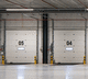 porte industrielle sectionnelle / en acier / à isolation thermique / automatique