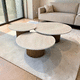 table gigogne contemporaine / en travertin / avec piètement en bois / ronde