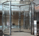 porte d'entrée / en inox / à tambour / vitrée