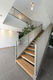 escalier quart tournant / à marches en bois / structure en métal / pour bâtiment tertiaire