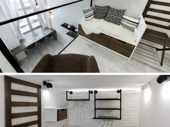 Cet appartement distinctement noir et blanc avec un niveau de mezzanine est à la maison pour de jeunes couples