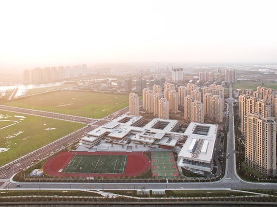 l'atelier Z + et studio plus de d encouragent des enfants à avoir une vie sociale à l'école primaire de Suzhou